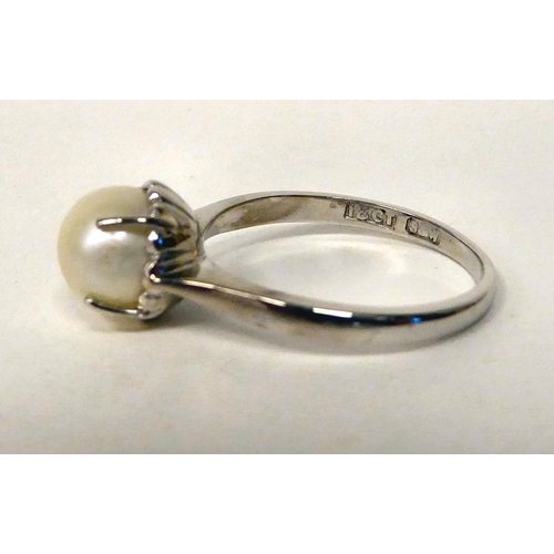 56 - An 18ct white gold, single stone claw set ring 