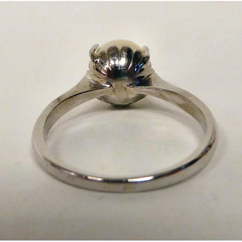 56 - An 18ct white gold, single stone claw set ring 