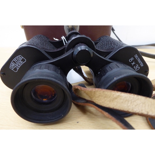 68 - A pair of Carl Zeiss Jena 8x30 binoculars; and another pair by Leica Trinovid  10