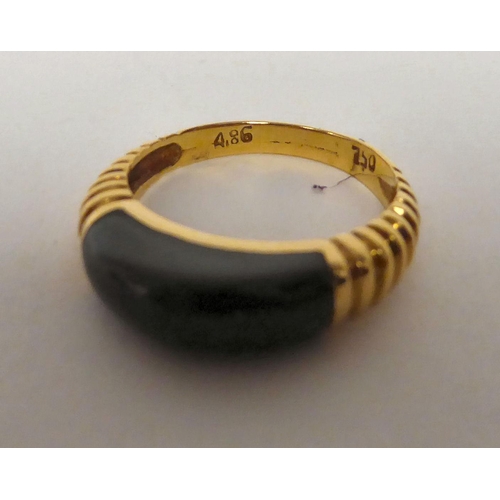 76 - An 18ct gold and malachite set ring 