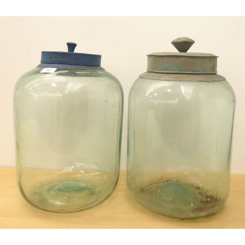 77 - Two vintage clear glass storage jars  16