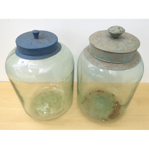 77 - Two vintage clear glass storage jars  16