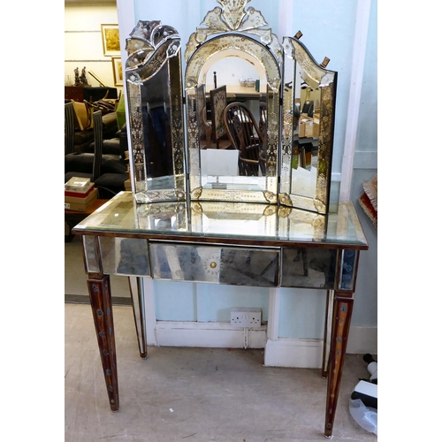 83 - A modern Venetian style partially mirrored dressing table with a central drawer, raised on square, t... 