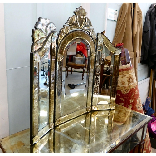 83 - A modern Venetian style partially mirrored dressing table with a central drawer, raised on square, t... 