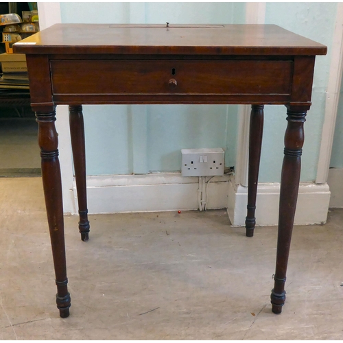 85 - A child's Victorian mahogany single drawer desk, raised on ring turned, tapered  legs  26