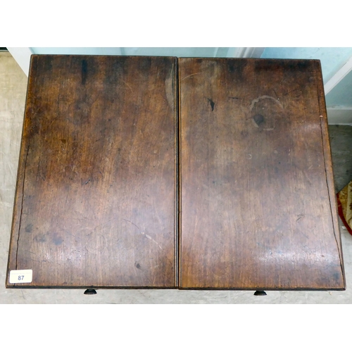 87 - A George III mahogany vanity unit with a pair of hinged flaps, revealing a mirror, over a brushing s... 