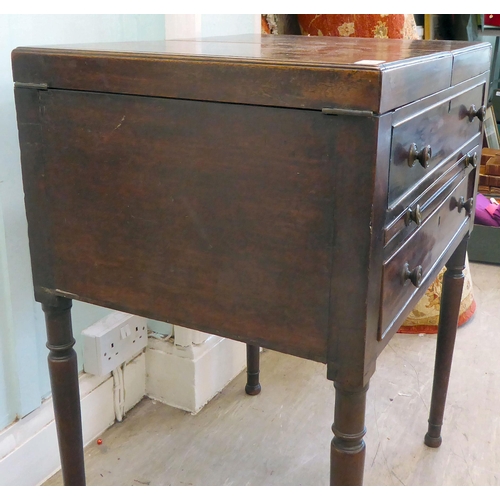 87 - A George III mahogany vanity unit with a pair of hinged flaps, revealing a mirror, over a brushing s... 