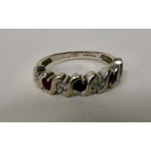 91 - A 9ct white gold, ruby and diamond set half eternity ring 