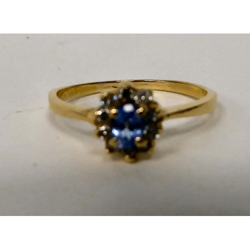 96 - A 14ct gold tanzanite and diamond set cluster ring 