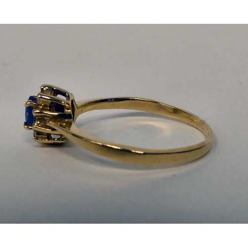 96 - A 14ct gold tanzanite and diamond set cluster ring 