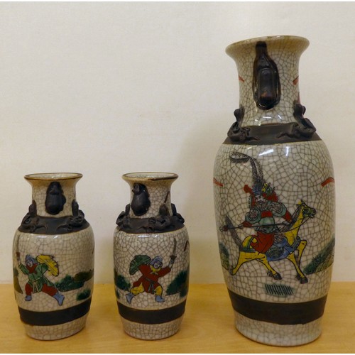 228 - 20thC Oriental ceramics: to include a pair of Japanese crackle glazed vases, decorated with warriors... 