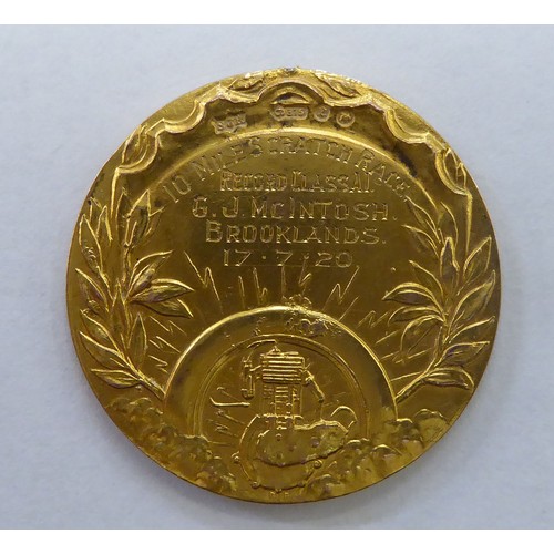 203 - A 9ct gold British Motorcycle Racing Club, engraved to celebrate the record holder of a 10 mile scra... 