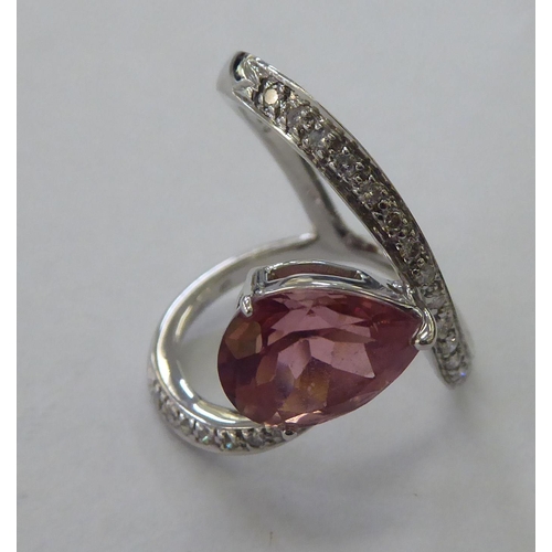 231 - An 18ct white gold pink tourmaline and diamond set ring