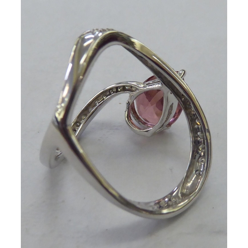 231 - An 18ct white gold pink tourmaline and diamond set ring