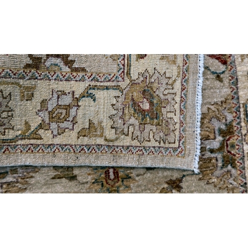 12 - Two Turkish rugs, decorated with floral designs, on cream coloured grounds  39