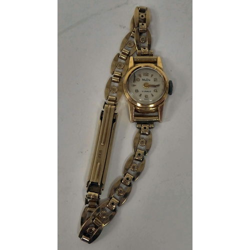 23 - A ladies Mudu yellow metal cased and strapped wristwatch  stamped 18k/750  approx. 12grms gross weig... 