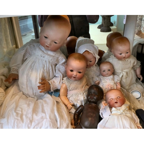 24 - Armand Marseille bisque head and other dolls  various sizes; and accessories