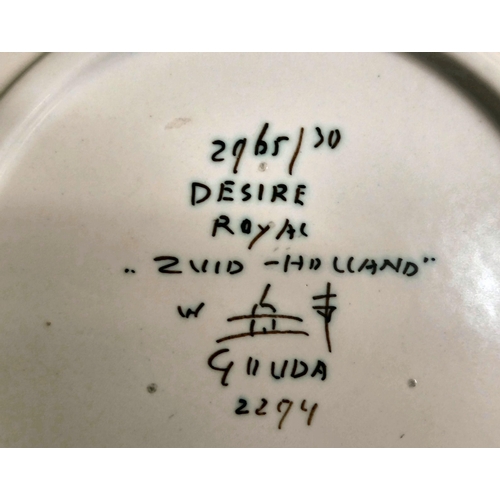 37 - A Gouda region Zuid-Holland pottery plate, decorated in bright colours  bears marks verso ... 