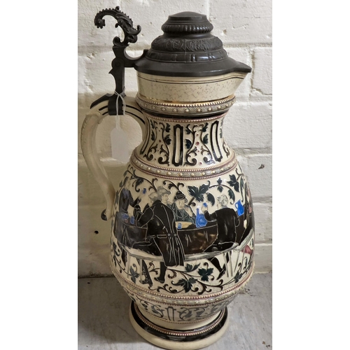 39 - A Bavarian pottery and metal lidded Stein, decorated with a jovial tavern scene  17