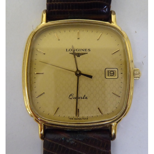 421 - A Timex steel cased and strapped wristwatch, faced by a baton dial; and another Longines gold plated... 