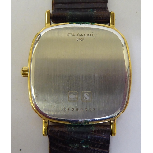 421 - A Timex steel cased and strapped wristwatch, faced by a baton dial; and another Longines gold plated... 