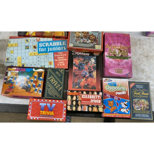 48 - Loose toys and board games: to include Trolls and other figurines; and a Jumanji board game