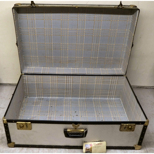 58 - A stud upholstered metal bound trunk with straight sides and a hinged lid  11