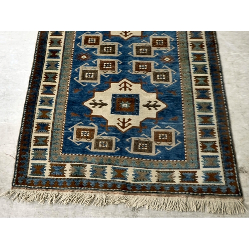 8 - A Turkish Kazak rug, decorated with repeating designs  58