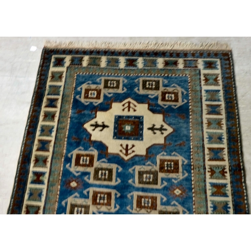 8 - A Turkish Kazak rug, decorated with repeating designs  58