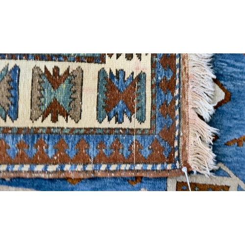 8 - A Turkish Kazak rug, decorated with repeating designs  58