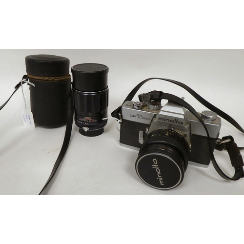 165 - A Minolta SRT303 35mm camera; an MC Rokkor-PF 1:17 f:50mm lens; and a Soligor Tele-Auto 1:28 F=135mm... 