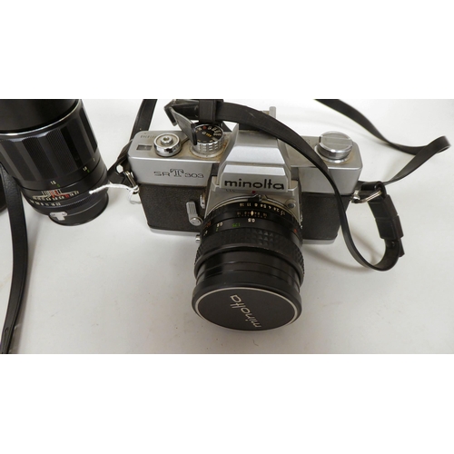 165 - A Minolta SRT303 35mm camera; an MC Rokkor-PF 1:17 f:50mm lens; and a Soligor Tele-Auto 1:28 F=135mm... 