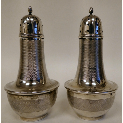 166 - A pair of silver casters of covered vase design with part engine turned decoration, caps and flame f... 