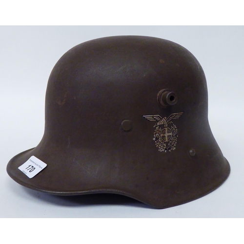 170 - A German World War II steel helmet with decal, hide liner and chinstrap (Please Note: this lot ... 