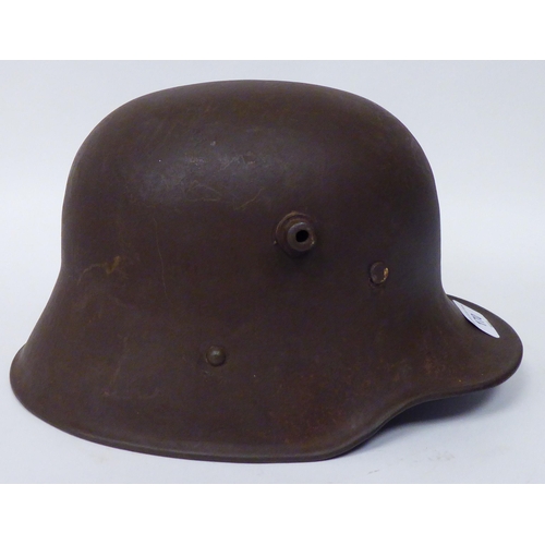 170 - A German World War II steel helmet with decal, hide liner and chinstrap (Please Note: this lot ... 