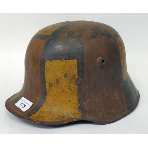 175 - A German World War I painted steel helmet with a hide liner and chinstrap(Please Note: this lot is s... 