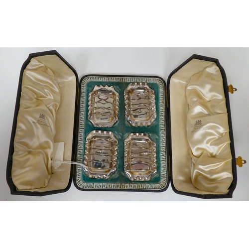 176 - A set of four silver wire framed, miniature four division toastracks, on crimped trays  JG&S  Bi... 