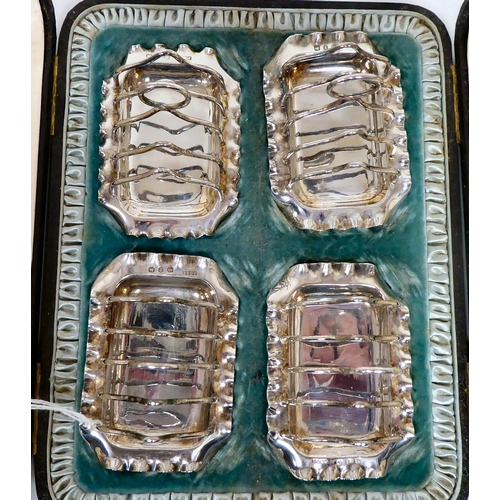 176 - A set of four silver wire framed, miniature four division toastracks, on crimped trays  JG&S  Bi... 