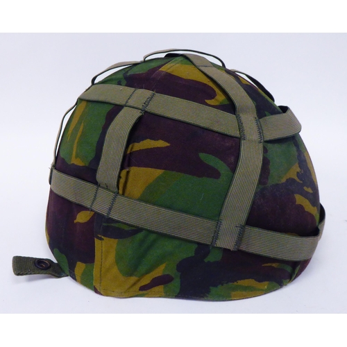 177 - Military items, some copies: to include a steel helmet with a camouflage cover; assorted buttons; an... 