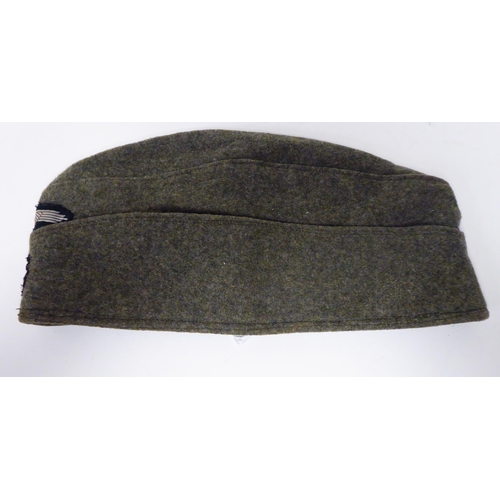 178 - A German SS khaki side cap(Please Note: this lot is subject to the statement made in the Auctioneers... 