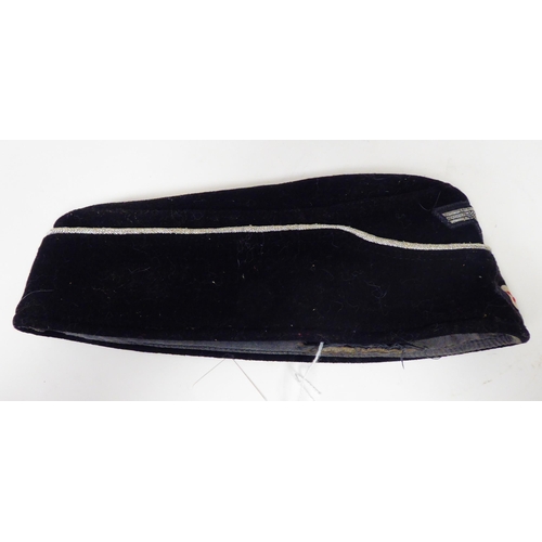 182 - A German Army black side cap with emblems(Please Note: this lot is subject to the statement made in ... 