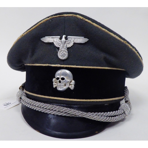 183 - A German SS peaked cap with white piping(Please Note: this lot is subject to the statement made in t... 