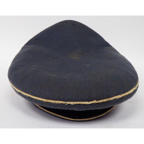 183 - A German SS peaked cap with white piping(Please Note: this lot is subject to the statement made in t... 