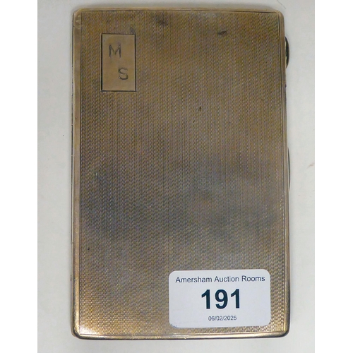 191 - A silver folding cigarette case with engine turned decoration, on a button clasp  R&D ... 