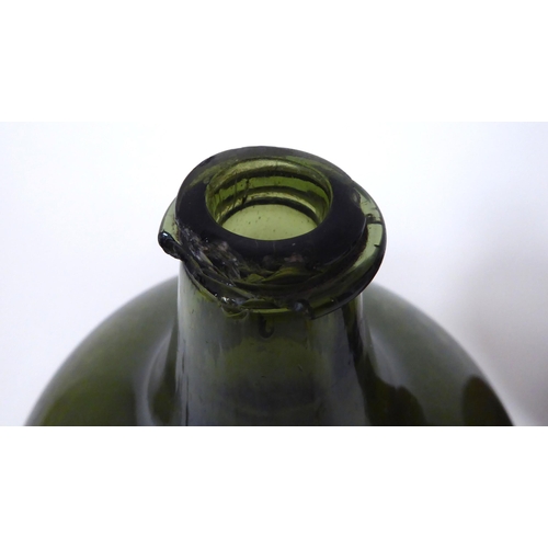 20 - Glassware: to include an early 18thC green glass wine bottle of squat, bulbous form  6.5