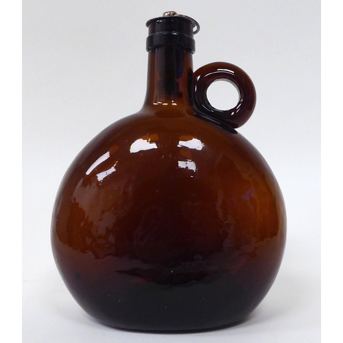 20 - Glassware: to include an early 18thC green glass wine bottle of squat, bulbous form  6.5