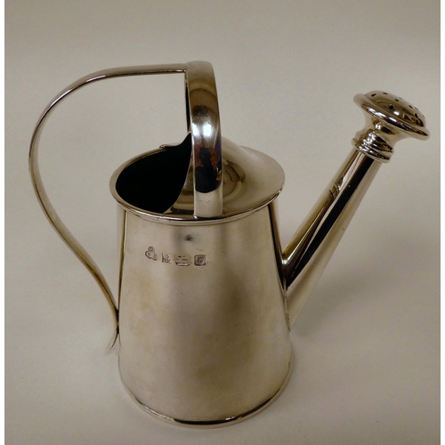 26 - A silver watering can of tapered form with an applied handle and angled spout  E&S  Bi... 