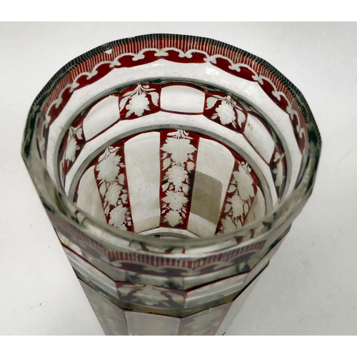 29 - A late 19thC Bohemian cut and engraved ruby coloured glass vase of cylindrical form, decorated in pa... 