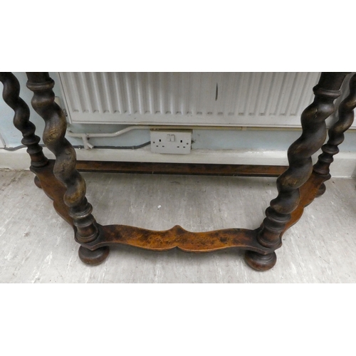 331 - An early 20thC marquetry inlaid oak and walnut demi-lune console table, raised on barleytwist legs  ... 