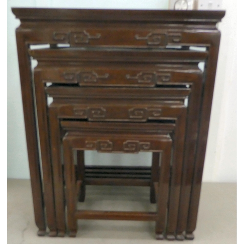 332 - A modern nesting set of four Chinese rosewood tables, raised on square, tapered legs  largest 2... 